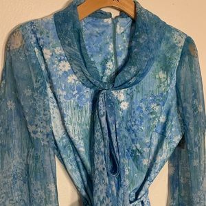 Ladies vintage blue floral blouse with neck tie and original belt. Size 14